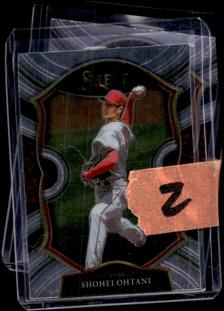 dcsports87 eBay lot listing photo of stacked baseball cards in toploaders with handwritten tape and uneven lighting